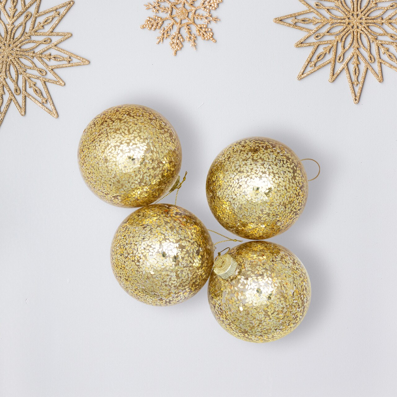 Northlight Metallic Leaves Christmas Glass Ball Ornaments - 4" (100mm) - Clear and Gold - 4ct